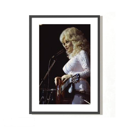 A fine art photo of Dolly Parton singing, with a close-up on her performing. Shot by Mick Rock. 