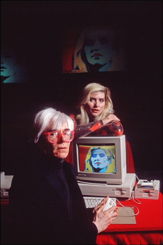 Debbie Harry and Andy Warhol ait at an Amiga computer at his studio in 1985. Archival, limited edition, signed fine art print by Allan Tannenbaum