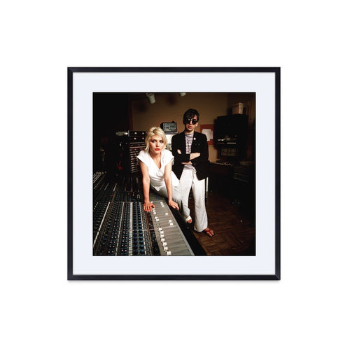 Debbie harry and chris stein at a soundboard in studio. A vintage photo by Allan Tannenbaum. 