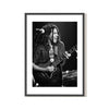 Fine art Black and white photo of Bob Marley performing on stage, with a guitar 1975 shot by Mick Rock. 