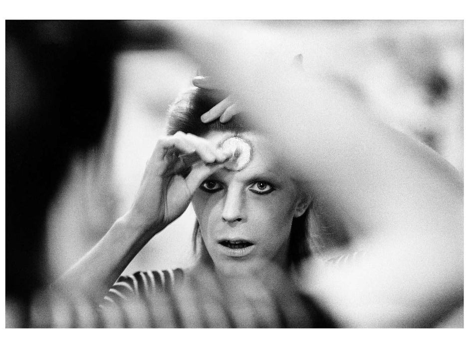 a fine art Close-up photograph of David Bowie, reflecting on a mirror, comes with with a signature stamp and the year 1973.