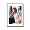 A limited edition fine art photograph of David Bowie, known as Ziggy Stardust by a window. The image is embossed with Mick Rock's signature stamp.