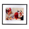 A fine art framed print of david bowie putting on makeup with bright red hair  in a circle mirror. Signed by the photographer Mick Rock. 