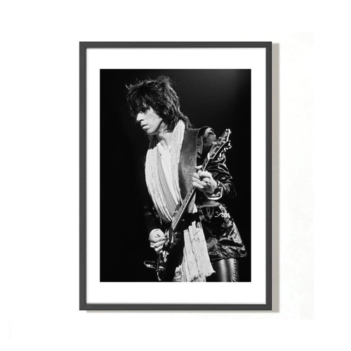 A fine art limited edition black and white photograph of keith richards performing, shot by mick rock. 