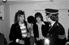 A black and white photograph featuring Rod Stewart, Mick Jagger, and Ronnie Wood with The Police, 1975.