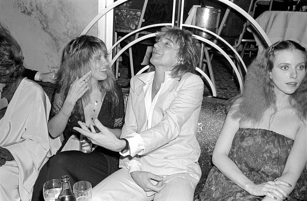 Black and white fine at photo of Rod Stewart, Stevie Nicks and Bebe Buell out in New York, 1977. Shot by Allan Tannenbaum. 