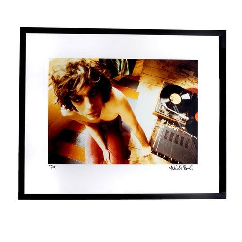 fine art photo of syd barrett sitting with record player shot by mick rock