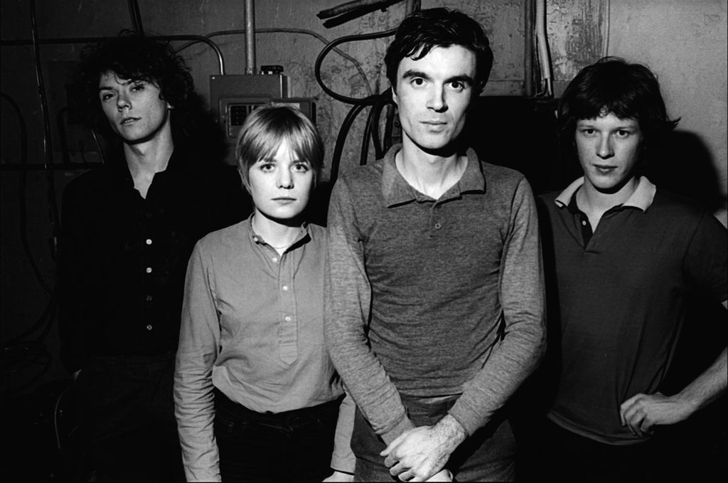 Black and white photograph of Talking Heads band members in a casual setting, 1977.