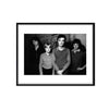 Black and white photo of the band Talking Heads standing together in NYC by photographer Allan Tannenbaum. 