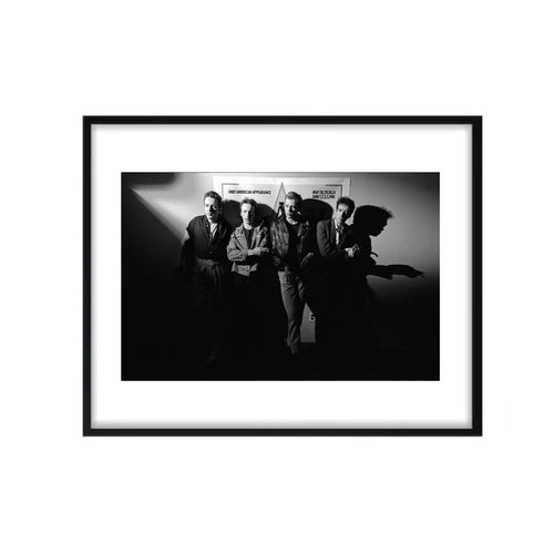 A framed photo of the band The Clash standing in NYC. Shot by Allan Tannenbaum. 